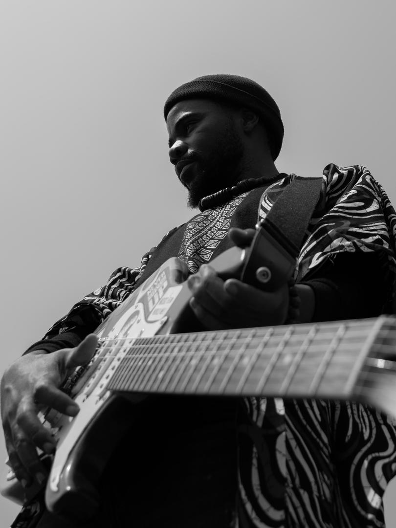 holding my instrument as a weapon for spreading positive messages of peace and hope 